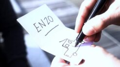 Close-up of the Viper Wallet trick with a hand drawing on paper.