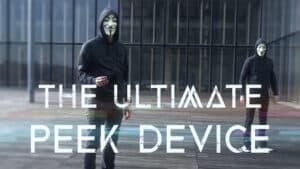 Two performers in masks demonstrating the Viper Wallet trick outdoors.