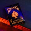 Bicycle Neon Solar-Orange Rider Back playing cards with vibrant design.