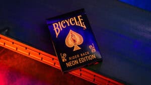 Bicycle Neon Solar-Orange Rider Back playing cards with vibrant design.