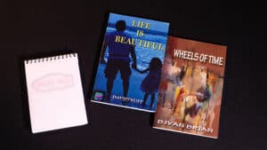 Close-up of two illustrated books used in the Magical Book Test by Uday Jadugar.