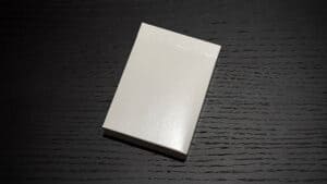 Red Invisible Deck card box for magic tricks, compact and professional.