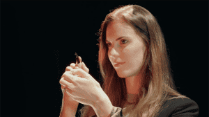 Woman performing magic with DUAL PAD by Victor Zatko, close-up shot.