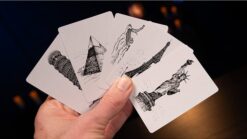 Hand holding illustrated cards from Final Destination magic trick by Murphy's Magic.