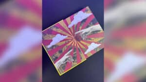 Colorful pop-up magic card with clouds and hands for illusions.