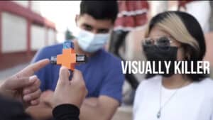 Close-up of a magic trick with a puzzle piece by Pilato, performed outdoors.