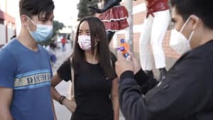 Magical tricks demonstration at Equix by Pilato with performers wearing masks.