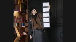 Performer demonstrating Prestige Pro magic trick with floating panels for audience.