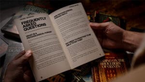 Up of a person holding a book on psychological magic and mentalism.