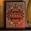 Red Mosaic Playing Cards deck with intricate gold designs, perfect for magic tricks and card illusio.
