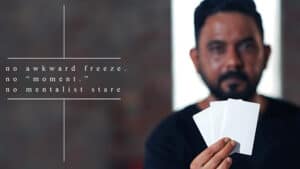 Magician performing a card trick with a blurred background, showcasing illusion and magic skills.