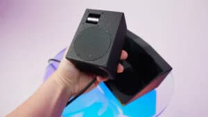 Hand holding a small magic fountain device for illusions and tricks.