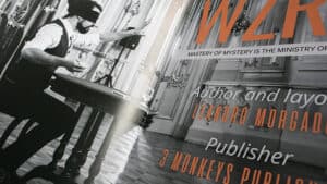 Performer performing a magic trick with cards and props for an audience.