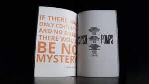 Close-up of a magic trick book page with text about mystery and certainty.