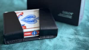 The QuickDraw Pro card magic trick by GRUM® showcasing a deck in a black case.
