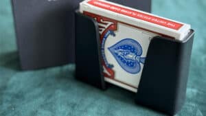 The QuickDraw Pro card magic trick by GRUM® with deck in black holder.