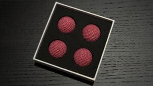 Bright pink crochet balls for magic tricks and illusions. Perfect for magicians and performers.