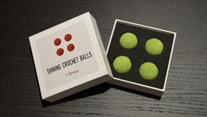 Bright green crochet balls for magic tricks and illusions. Perfect for magicians and performers seek.