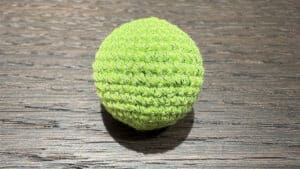 Bright grass green crochet ball for magic tricks and illusions. Perfect for close-up magic performan.