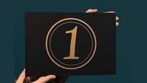 Close-up of a stage card with the number 1 for magic tricks and illusions.