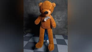 Large teddy bear magic prop for illusions and performances.