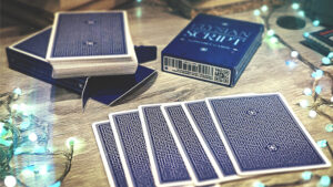Close-up of playing cards for magic tricks on a wooden table.