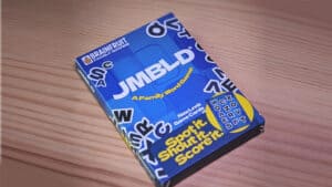 Stegosaurus Pro card game box with colorful design on wooden surface.