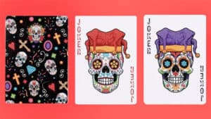 Colorful sugar skulls and jester cards for Day of the Dead celebrations.