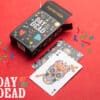 Colorful Day of the Dead themed playing cards with skull design, perfect for Halloween and festive c.