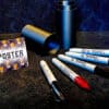 Sharpie markers and container for the Sharpie Imposter magic trick.