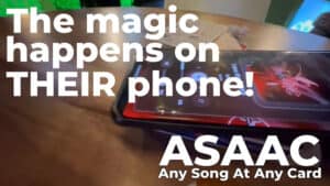 Person performing a card magic trick on a smartphone screen.