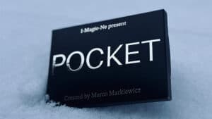 Close-up of the blue magic trick box titled "Pocket" by Marco Markiewicz on snowy surface.