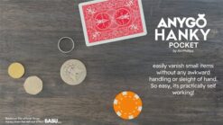 Close-up of Anygo Hanky pocket trick with cards and coins on a wooden surface.