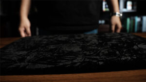 Close-up of Black Art magic pad set used in professional magic performances.