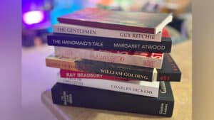 Close-up of stacked classic books used in the book test illusion.