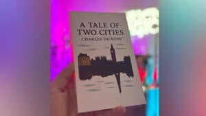 Close-up of "A Tale of Two Cities" book used in magic card trick performance.