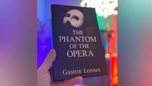 Book cover featuring "The Phantom of the Opera" by Gaston Leroux with a mysterious mask illustration.