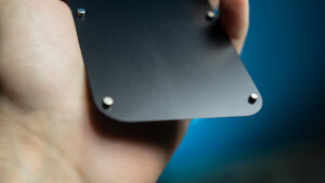 Close-up of a hand holding a Leviosa Phone with an extra screen by João Miranda and Julio Montoro.