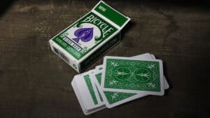 Green mini bicycle playing cards for magic tricks and card illusions.