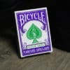 Purple Bicycle Rider Back playing cards for magic tricks and card illusions.
