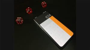 Smartphone with calculator app and dice, showcasing magic tricks and illusions.