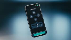 Smartphone with audio editing app for magic tricks demonstration.