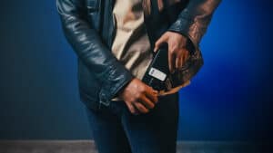 Person performing a magic trick with a smartphone.