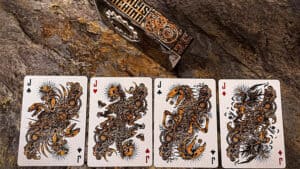 Mortalis Machina Iron Standard Edition playing cards with intricate dragon designs.