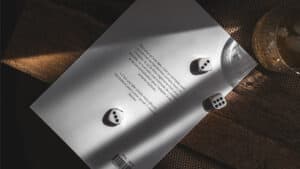 Three dice on paper with shadow effects, magic trick setup for Jeu de Hasard.