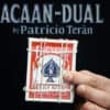 Close-up of ACAAN dual card trick by Patricio Terán with playing cards and rubber bands.