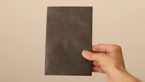 Envelope stage magic trick with a black envelope for illusions and card tricks.