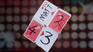 Reform 52 magic trick with playing cards and numbered blocks for illusions and card magic.