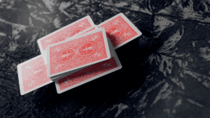 Up of WAKEN PRO playing cards for magic tricks on a dark surface.