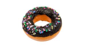 Chocolate donut with colorful sprinkles, perfect for magic tricks and illusions.